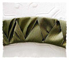 A closeup of the woven ribbon on the wire wreath frame.